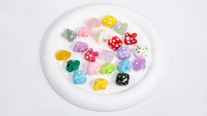 Colorful acrylic mushroom beads with polka dots and smiling faces for DIY jewelry crafts
