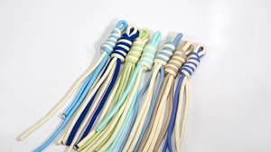 Detailed view of colorful twisted knot wrist straps showing hand-woven textures and patterns