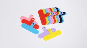 Close-up of colorful T-shaped phone lanyard connector patches in various vibrant colors
