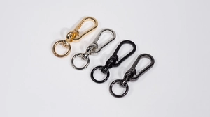Detailed close-up of 360-degree rotating lobster clasps in four electroplated metal colors