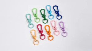 Close-up of colorful matte spring hooks for DIY bag accessories and keychains
