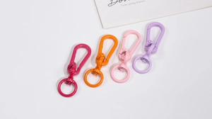 Macro shot of colorful lacquer metal lobster clasps and swivel spring hooks for DIY crafts