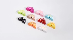 Macro detail of colorful acrylic rainbow charms for DIY jewelry and bag decorations