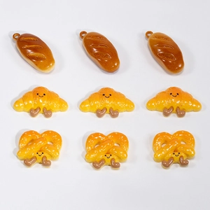 Set of 9 cute cartoon bread charms featuring croissants, pretzels and baguettes for DIY crafts