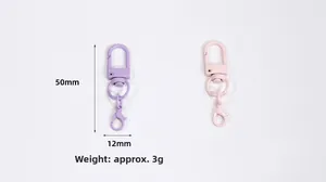 Close-up of 50mm purple and pink swivel lobster clasps for DIY bag accessories