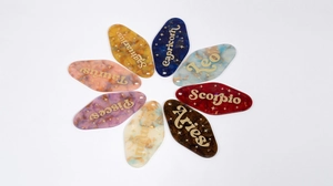 Glitter acrylic hotel key tags with constellation names in marble and translucent finishes