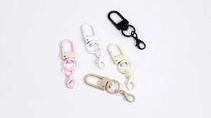 Detail view of multi-colored swivel lobster clasps for DIY keychains and bag charms