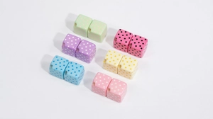 Detailed view of colorful acrylic cube beads with polka dot patterns for DIY jewelry making