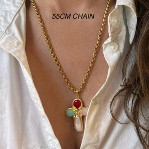 Detailed view of a 55cm gold chain necklace with a colorful beaded cross and pearl pendant