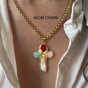 Golden titanium steel cross necklace with colorful gems and 45cm chain worn by model