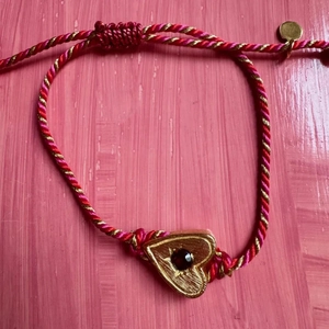 Vintage tarot heart charm bracelet with red stones and braided adjustable silk cord