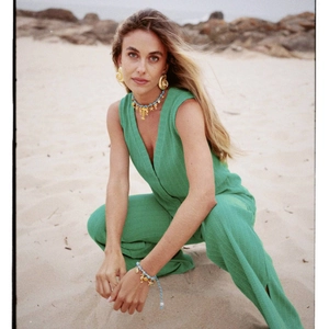 18K gold plated ocean jewelry set with starfish pendants on model at the beach