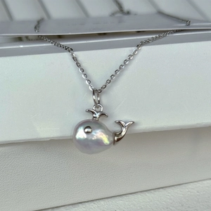 Baroque irregular pearl whale pendant necklace with shimmering silver finish cross chain