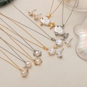 Baroque pearl jewelry set featuring marine life pendants in gold and silver finish
