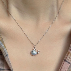 Baroque pearl whale pendant necklace in silver finish worn on model neck
