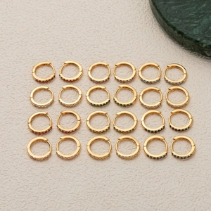 Set of 24 pairs of 14k gold plated hoop earrings with multicolored birthstones and gems