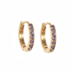 Close-up of gold huggie earrings featuring purple zircon stones in a pave setting