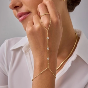 18k gold plated stainless steel hand chain with round zircon accents and gold beads