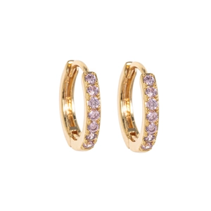 Detail of 14k gold plated round hoop earrings with channel-set lavender zircons