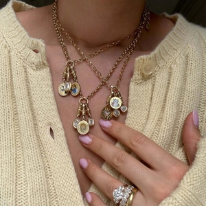 Layered 18k gold plated necklace set with rabbit and lion tarot pendants on a model