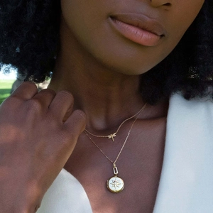 Vintage gold layered necklace set with dragonfly charm and sunburst medallion pendant