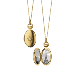 Detail of 18K gold star diamond oval locket showing both open and closed photo frames