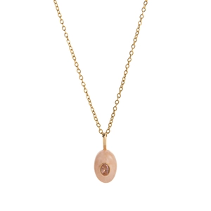 Minimalist gold chain necklace with oval pink gemstone pendant for a modern jewelry look