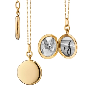 Detailed view of 18K gold oval locket necklace showing open photo slots and 750 hallmark