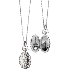 Detail of vintage silver oval locket necklace showing 925 stamp and photo interior
