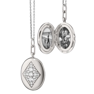 Detail of 925 silver oval locket necklace with pavé-set crystals showing open and closed states