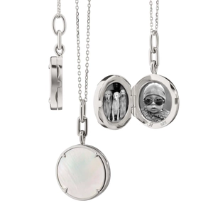Detail view of round 925 sterling silver locket necklace with mother of pearl inlay