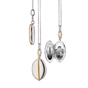 Detail showing an open oval locket with dual frames and inner 925 silver metal hallmarks