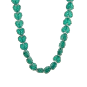 Detailed view of translucent emerald green resin heart beads with a matte finish texture