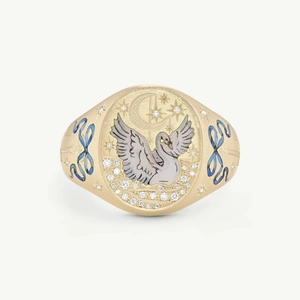 Detail of gold swan ring with crescent moon star motifs and blue enamel inlay