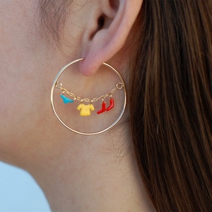 Creative laundry line hoop earrings featuring colorful enamel shirt and boots charms