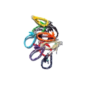 Detailed stack of colorful ethnic print fabric bracelets with metal toggle clasps