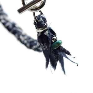 Detail of silk bracelet with T-bar clasp, blue printed fabric and turquoise bead