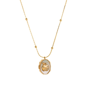 Golden locket necklace with oval pearl shell inlay and sparkling apple pendant charm