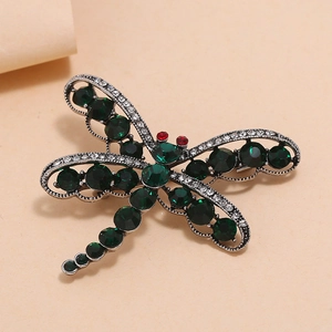Broche libellule vintage avec gemmes vertes et strass blancs sur alliage argenté