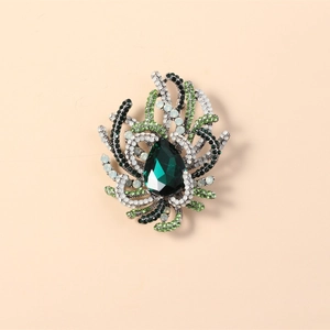 Vintage style brooch with large teardrop green gemstone and sparkling crystals