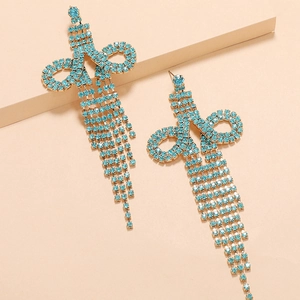 Elegant long fringe tassel earrings with light blue rhinestones in a butterfly bow design