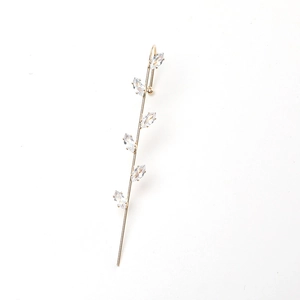 Minimalist gold leaf ear cuff with marquise-cut zircons in a branch-inspired geometry