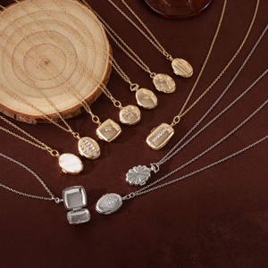 Detailed close-up of gold and silver locket necklaces in oval, square and round shapes