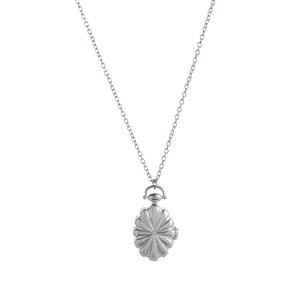 Detailed macro view of vintage silver locket pendant with radial sunburst pattern on O-chain