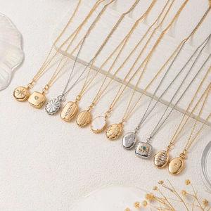 Vintage locket necklaces in gold and silver finish with starburst and stone details