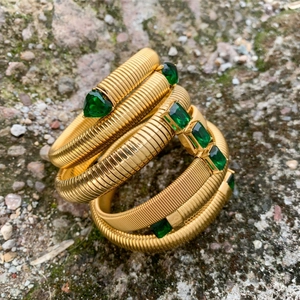 18K gold plated tubogas wrap bracelet with vintage green zircon stones in outdoor setting