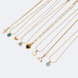 Selection of minimalist gold plated stainless steel necklaces with varied gemstone pendants