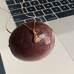 Exquisite gold ladybug pendant necklace with shimmering zircon stones on a fine chain