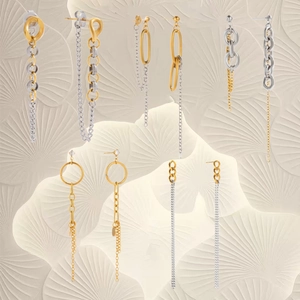 Elegant gold and silver tassel earrings set with geometric rings and long fine chains