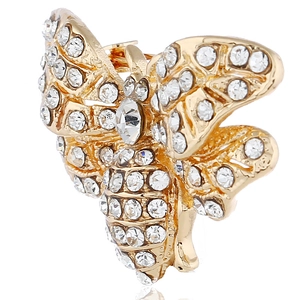 Macro detail of bee brooch featuring gold plating and shimmering white crystal inlays
